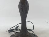 a close up of a lamp on a table with a white background