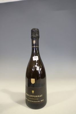 the bottle of champagne is sitting on the table