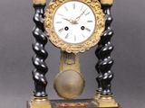 a clock that is sitting on top of a table