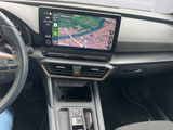 the dashboard of a car with a gps device in the center of it