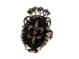 une image représentant une bague noire et dorée ornée d'une couronne