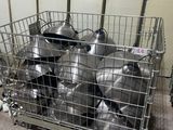 many pots and pans in a metal basket