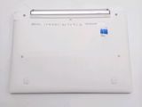a white laptop with a blue sticker on it