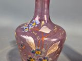two vases that are sitting on a table next to each other