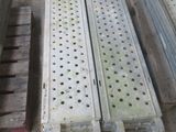 several pieces of metal are stacked on top of a pallet