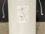 an image of a white water heater on the floor