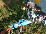 a blue trailer that has a bunch of items on it