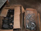 two boxes with different types of metal parts in them