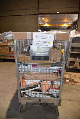a cart with a lot of items in it in a warehouse