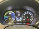 a close up of a car dashboard with various gauges
