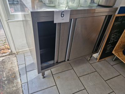 a stainless steel refrigerator with a glass door on the outside