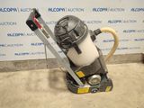 a close up of a vacuum with a hose attached to it