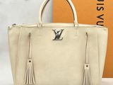 louis vuitton beige leather tote bag with tassels