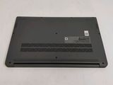 the back of a laptop with a small battery on top of it