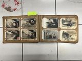 an old photo album with a lot of pictures on it
