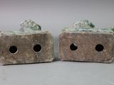 two pieces of stone sitting on top of each other
