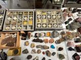 many different types of rocks and stones on the table