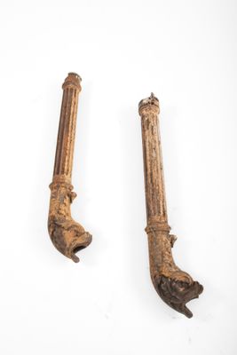 pair of antique cast iron pipe wrens on a white background