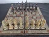 a chess board with a lot of chess pieces on it