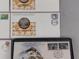 four envelopes with stamps and a picture of a man on top of a mountain