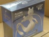 a box with a pokemon figure in it on the floor
