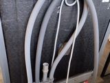 an image of a close up of a guitar amp with a hose attached to it