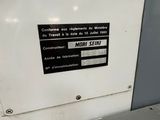 a machine that has a sign on the side of it
