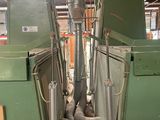 a green machine that is inside of a building