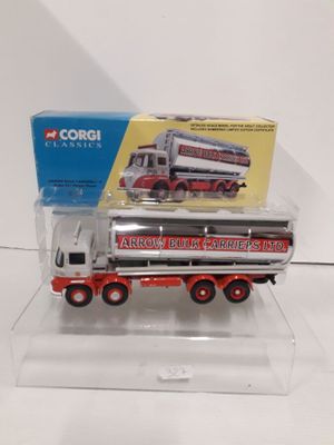 a red and white truck with a box on the back of it