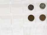 a lot of coins that are sitting on a table