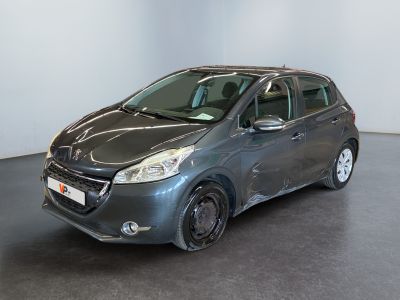 the grey car is parked in a large room with a black floor