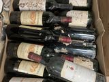 many bottles of wine in a box on the table