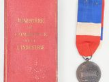 an old book with a medal and a medal on top of it