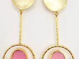 a pair of pink and gold earrings on a white background