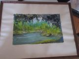 une photo d'un tableau représentant une rivière, dans un cadre en bois