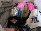 a suitcase full of clothes and other items in it