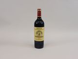 a bottle of wine that is sitting on a table