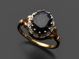 une bague en or sertie d'un diamant noir