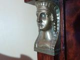 a metal head on a door handle in a room