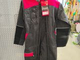 a black and pink snow suit on display in a store