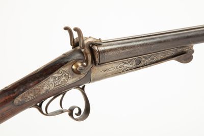 a close up of a gun on a white background with a white background
