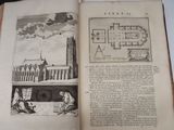 an open book with a drawing of a castle on it