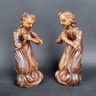 pair of carved wood figurines of a woman and child