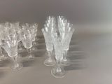 a lot of wine glasses sitting on a table