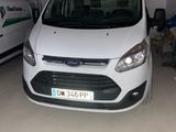the white van is parked in the garage next to the white van