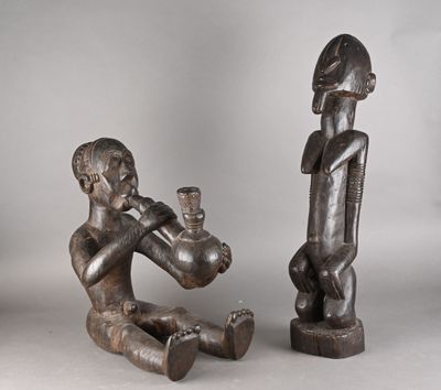 paire de figurines africaines en bois sculpté représentant un homme et une femme
