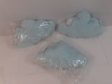 three pieces of blue soap sitting on a white surface