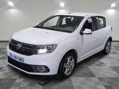 a picture of a white dacia parked in a garage