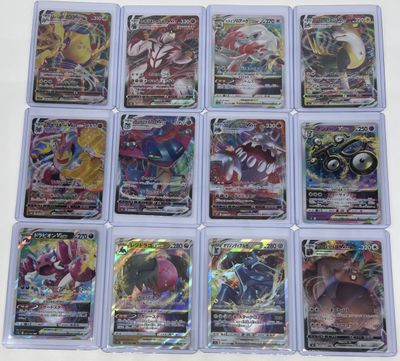 a close up of a bunch of pokemon cards on a table