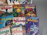 a lot of comic books that are on the table